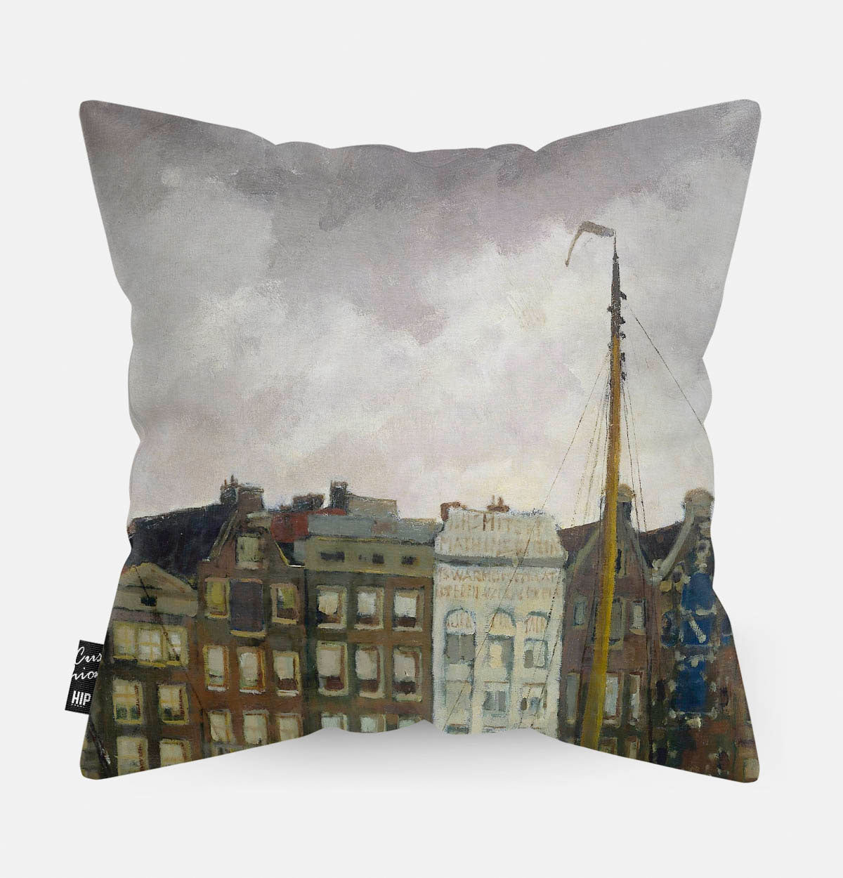 Kussen met schildering van damrak in Amsterdam erop afgebeeld.