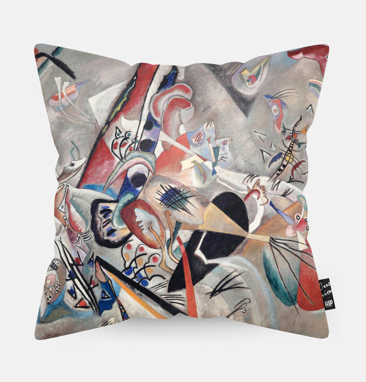 Kussen met moderne kunst erop afgebeeld.