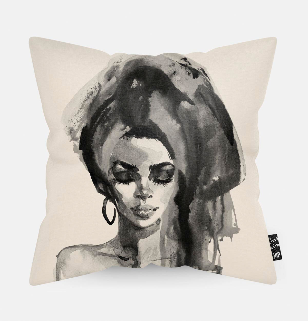 Beige kussen met een zwart wit vrouw erop