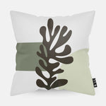Kussen met line art met groen koraal erop afgebeeld in abstracte vorm.