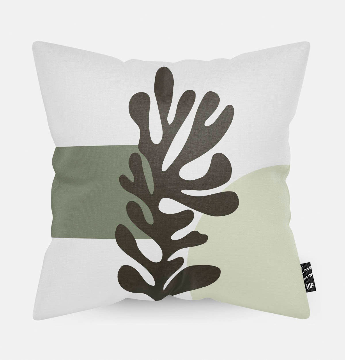 Kussen met line art met groen koraal erop afgebeeld in abstracte vorm.