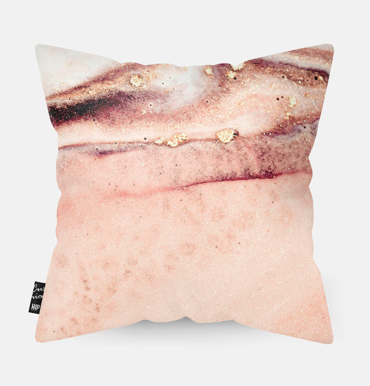 Kussen met de binnenkant van een blush geode erop afgebeeld.