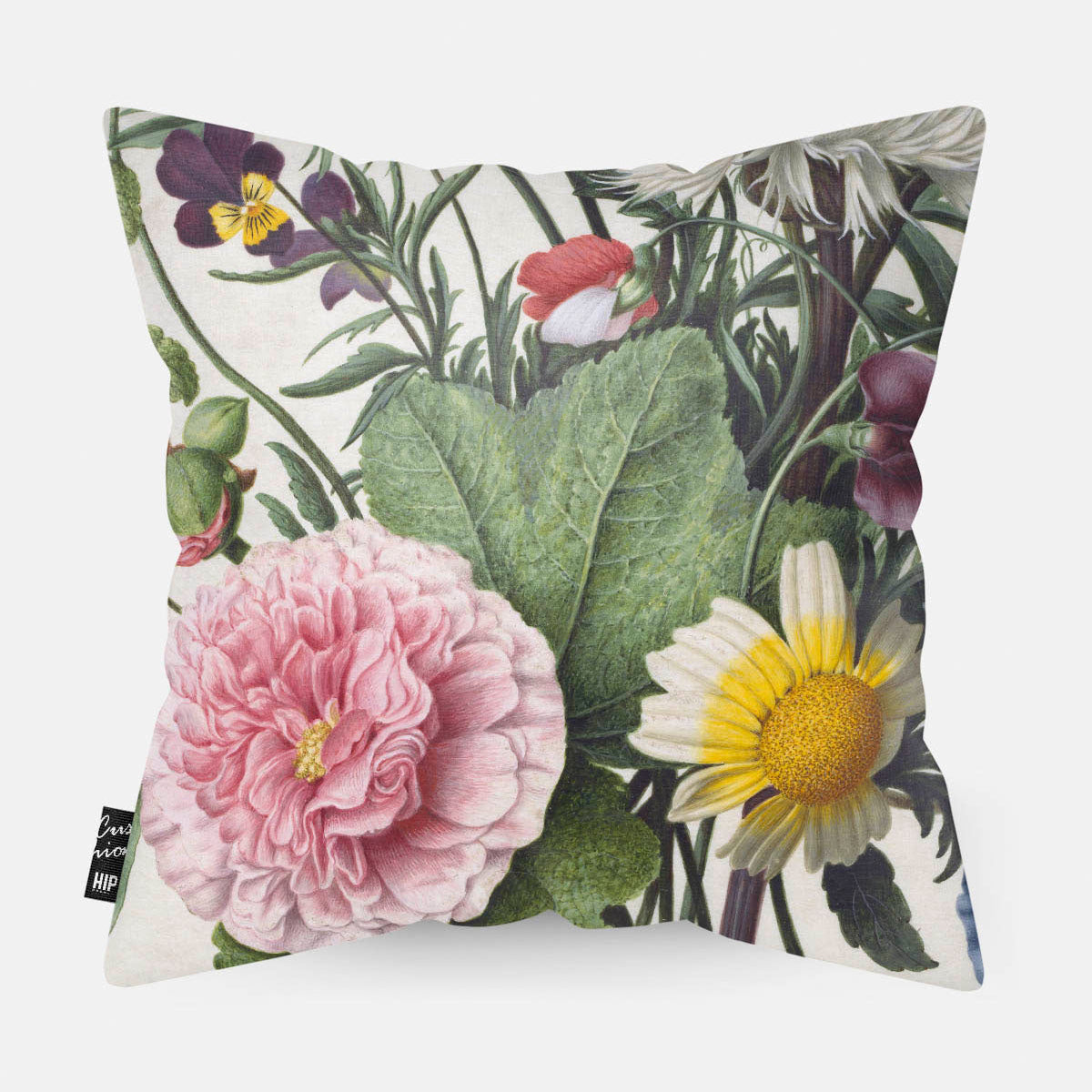 Kussen met schilderij van een boeket bloemen erop afgebeeld in detail.