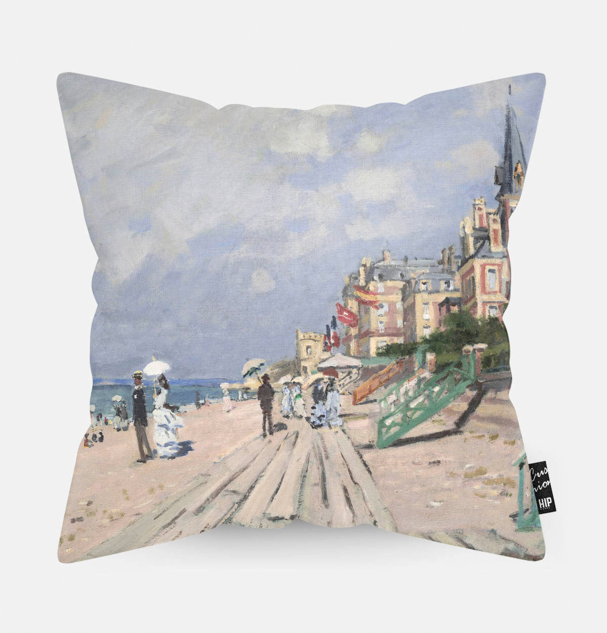 Kussen met schildering van de promenade van Trouville erop afgebeeld.