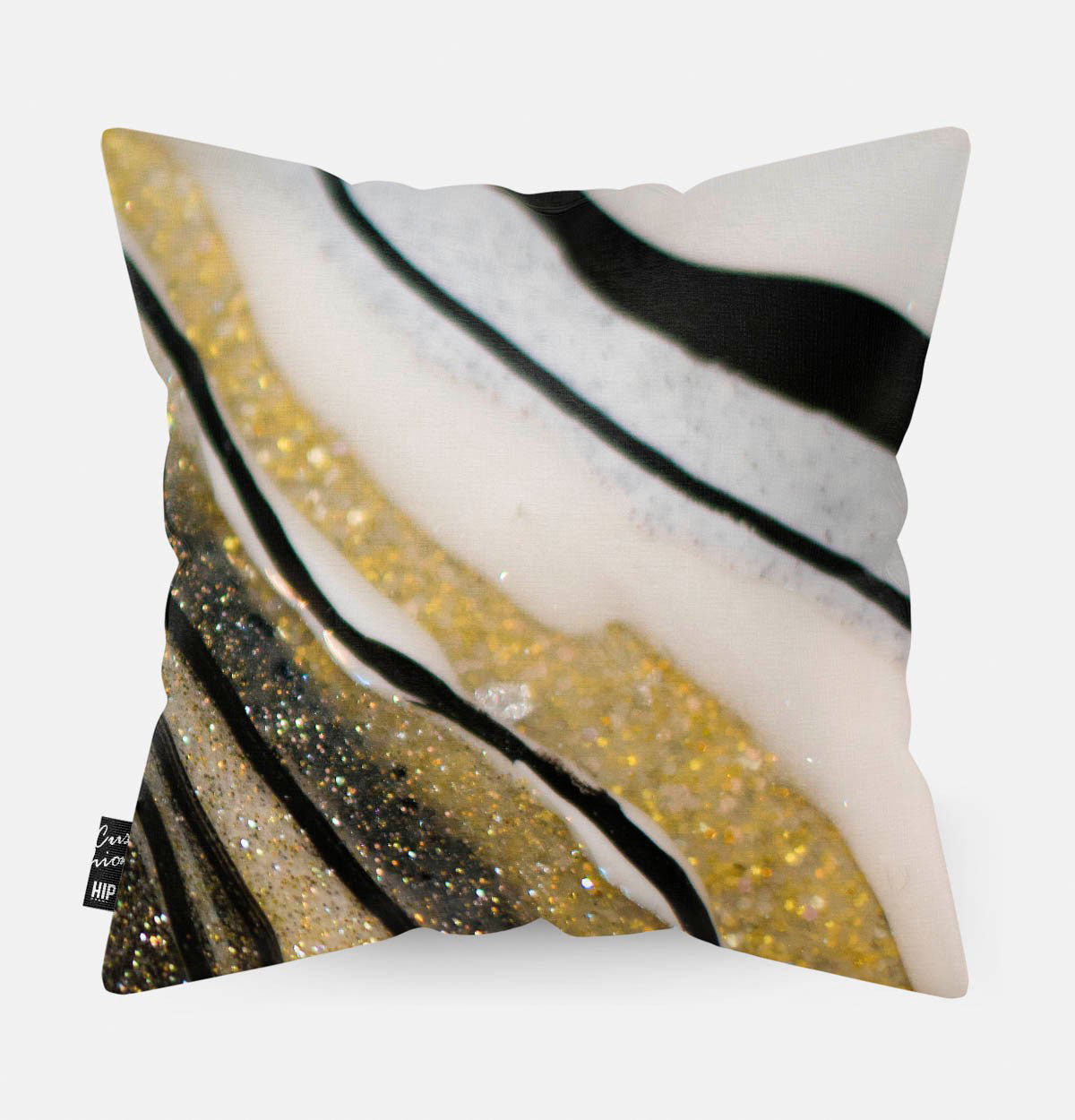 Kussen met gouden agate steen erop afgebeeld.