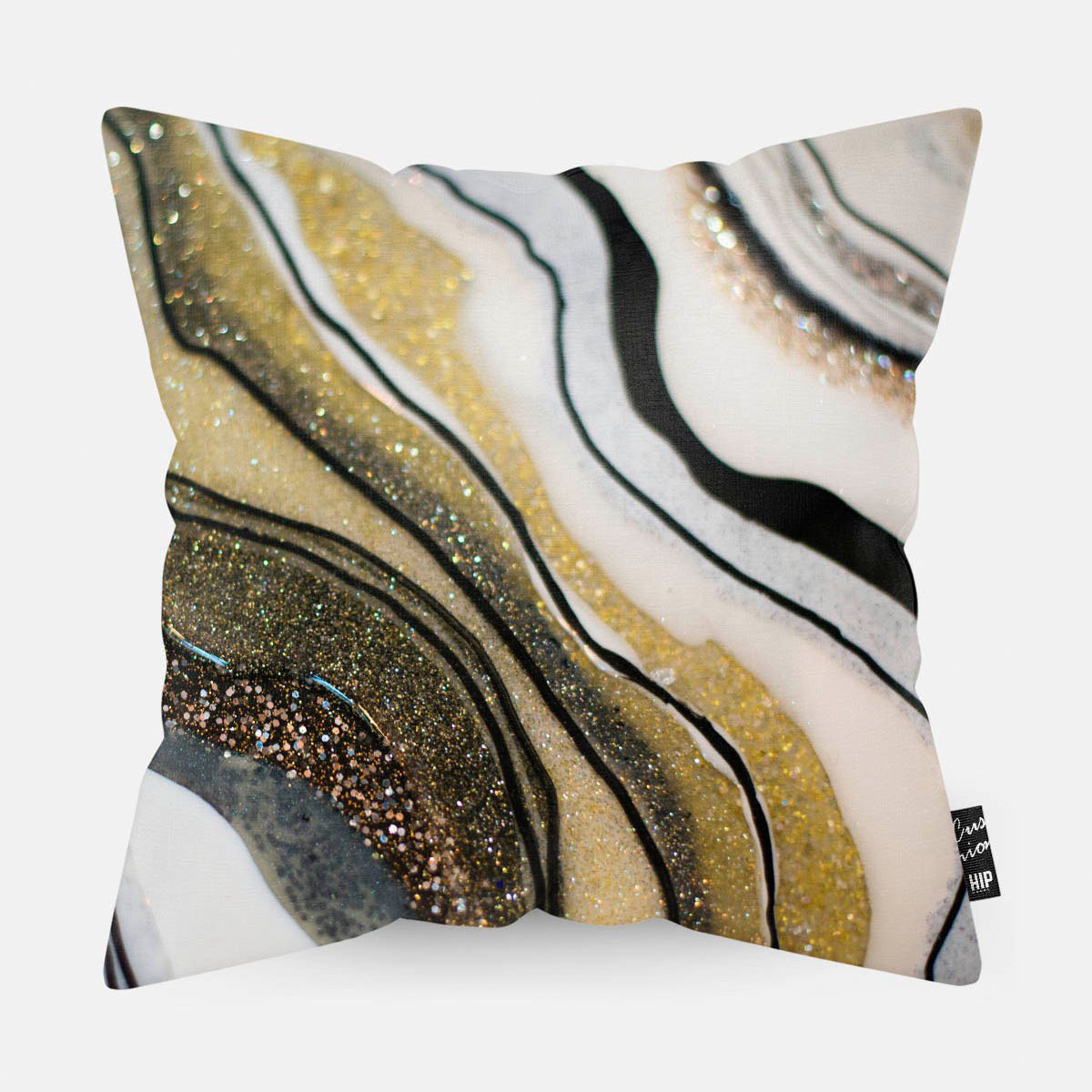 Kussen met gouden agate steen erop afgebeeld.