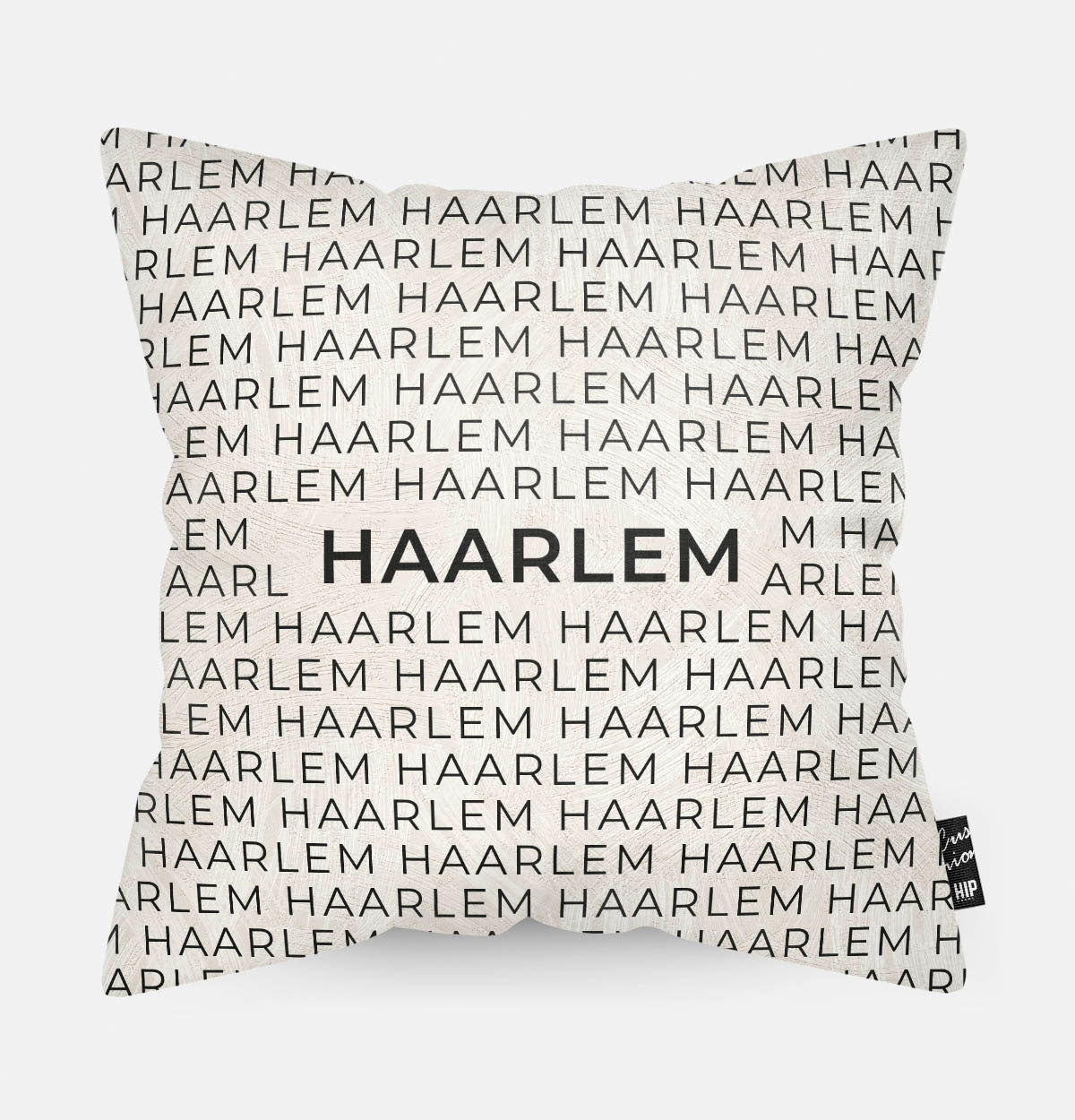 Sierkussen met stad en map Haarlem in tekst en zwart wit