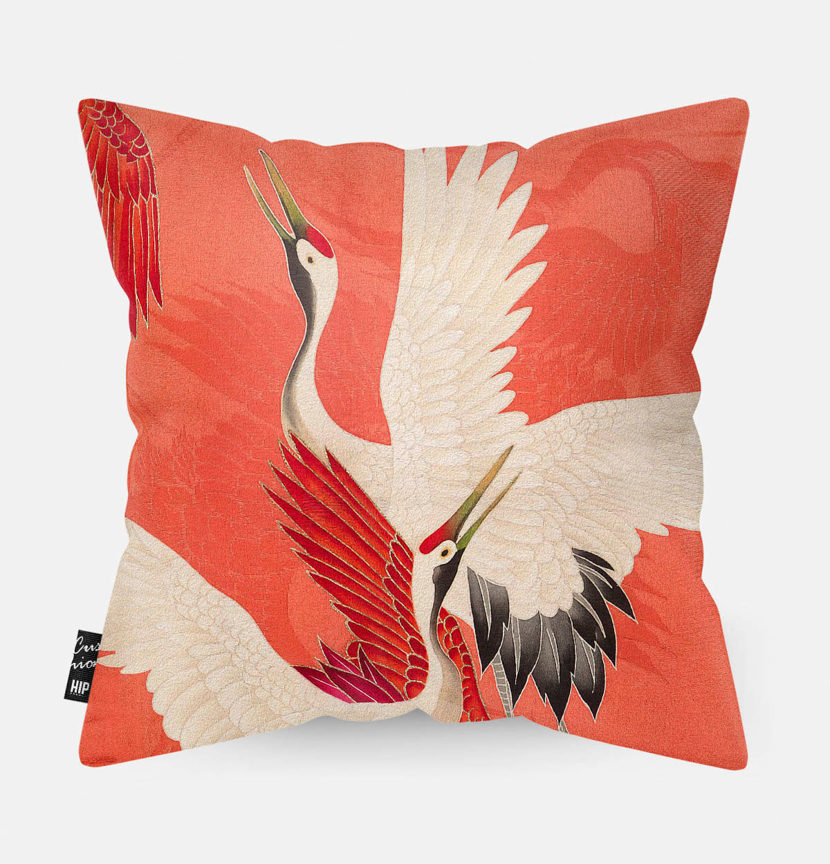 Kussen met kraanvogels erop afgebeeld.