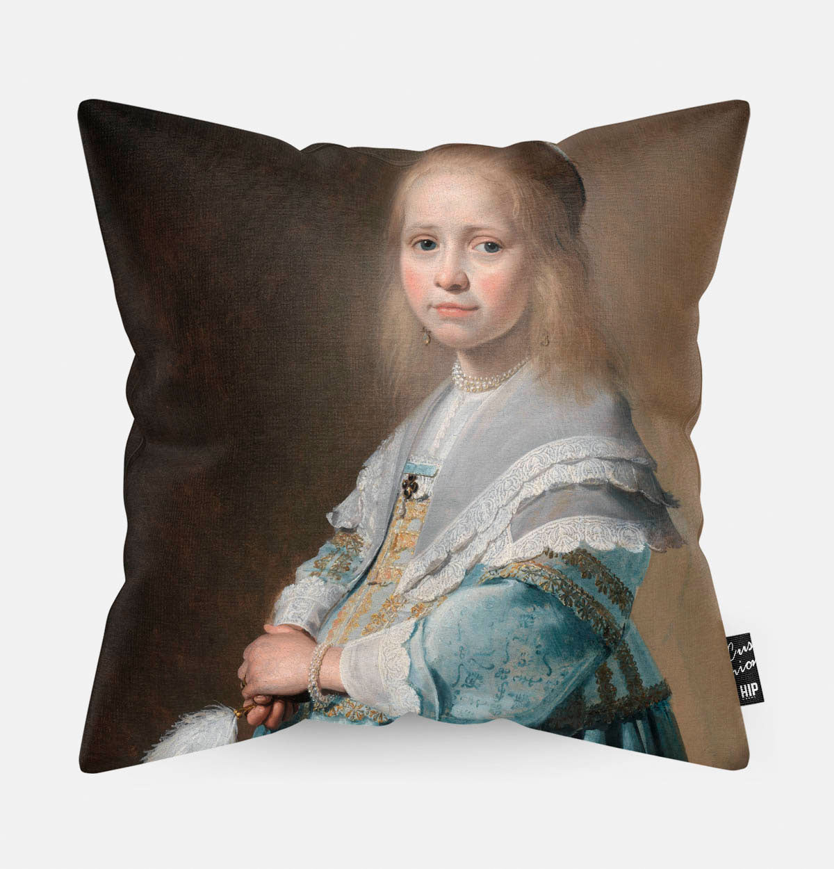 Kussen met schilderij van portret van een meisje in het blauw erop afgebeeld.