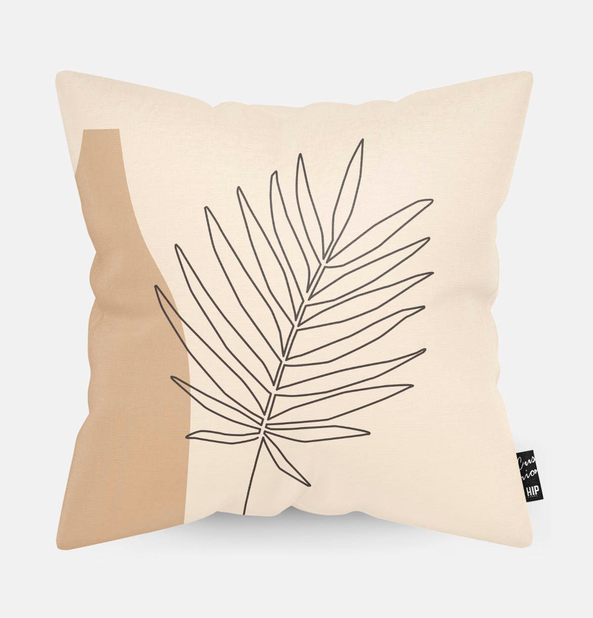 Kussen met plant erop in abstracte vorm.