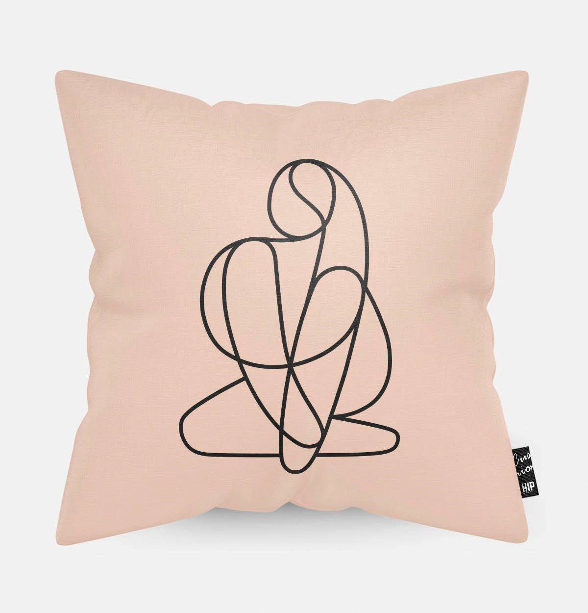 Kussen met line art met vrouwenlichaam erop afgebeeld.