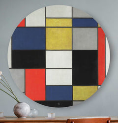 Mondriaan wandcirkel rood, geel, grijs, blauw, wit hangend aan de muur