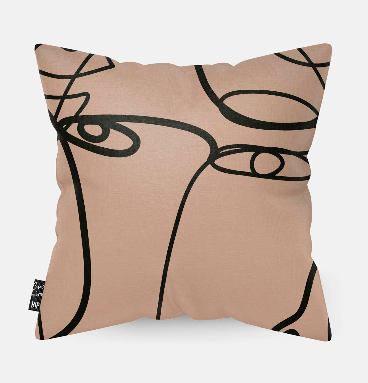 Kussen met line art met verschillende vrouwengezichten erop.