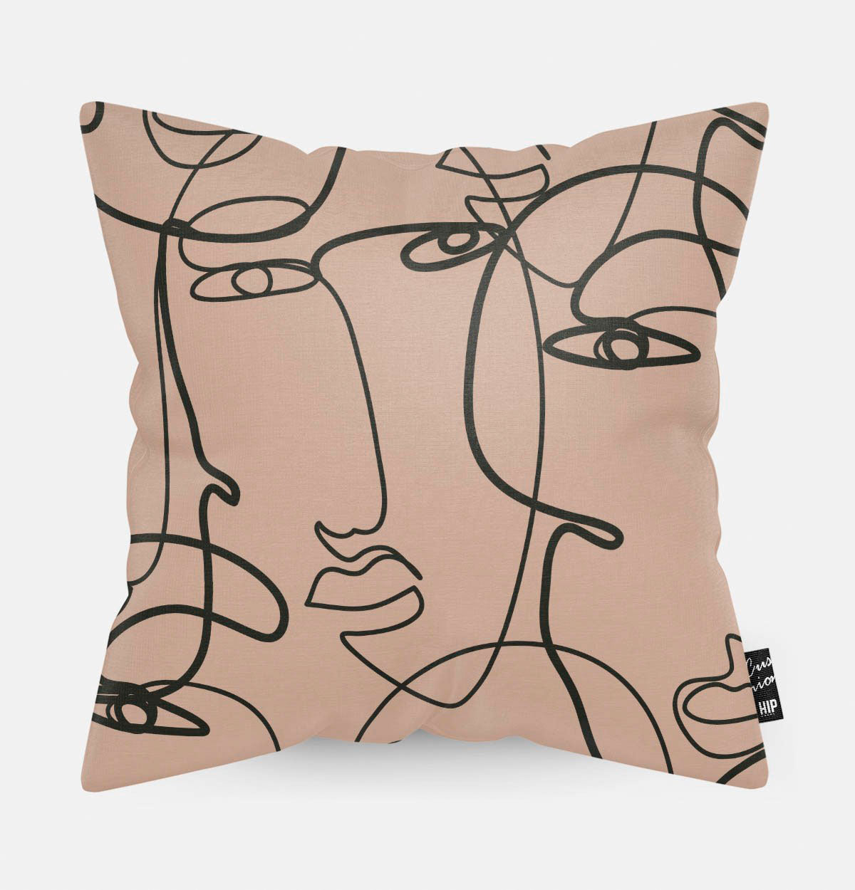 Kussen met line art met verschillende vrouwengezichten erop.