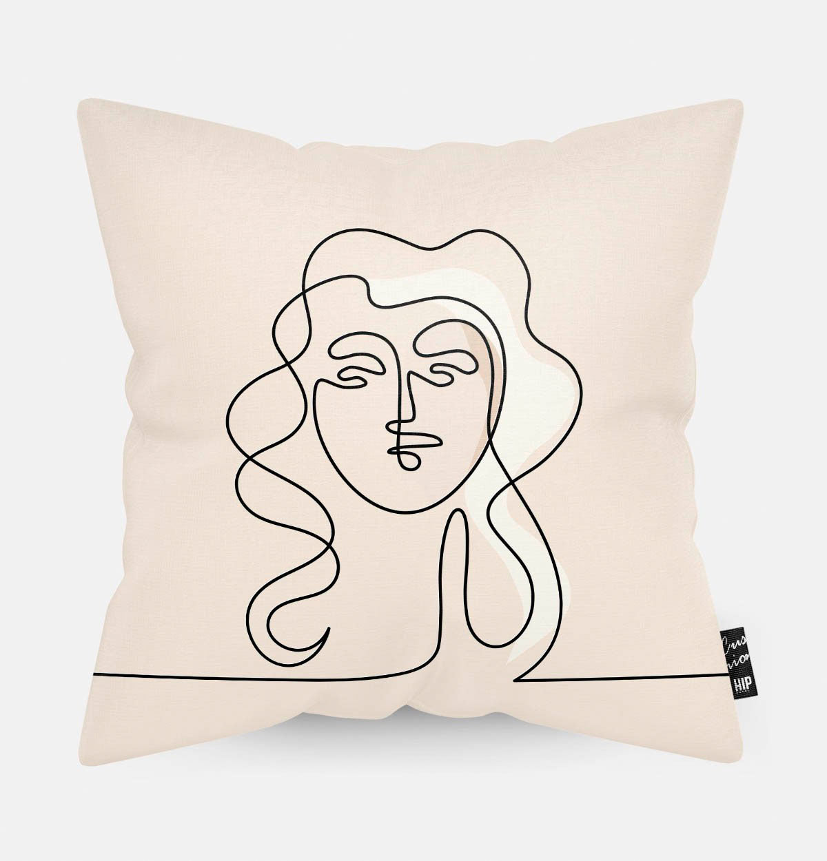 Kussen met line art van vrouwengezicht met krullen erop.