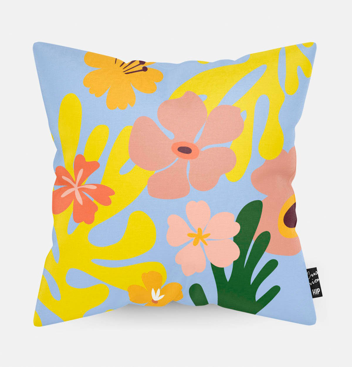 Kussen met verschillende kleurrijke bloemen op een blauwe achtergrond van de bloemen erop.