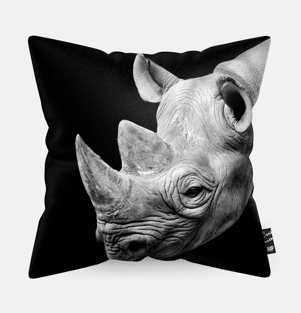 Kussen met een neushoorn in zwart-wit erop afgebeeld.