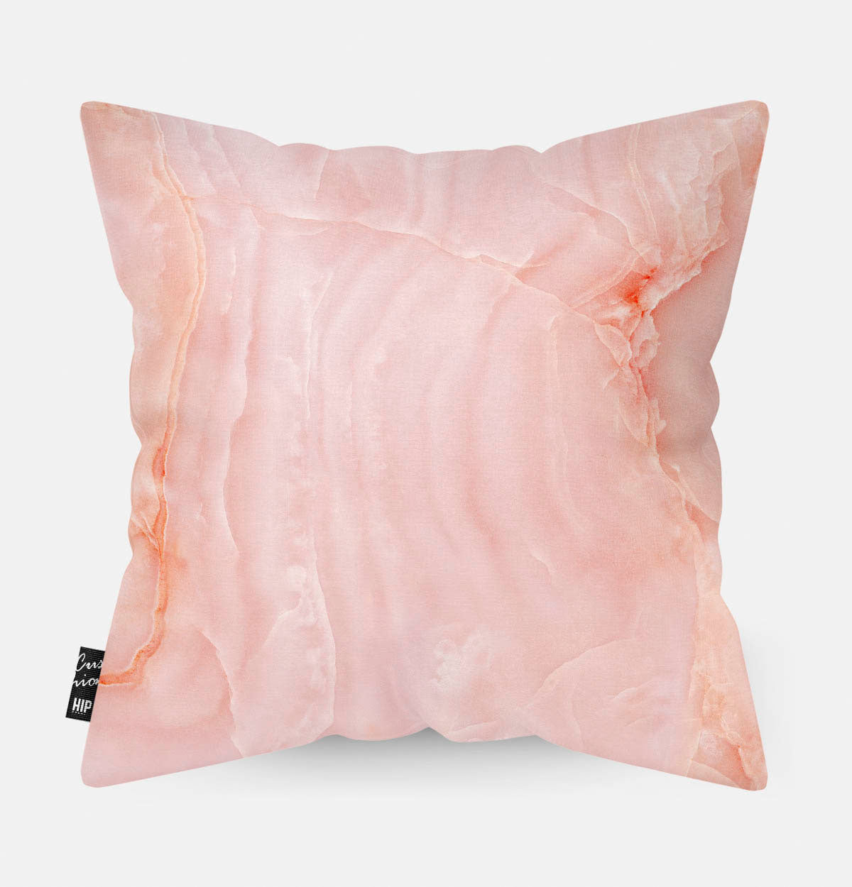 Kussen met roze marmeren steen erop afgebeeld.