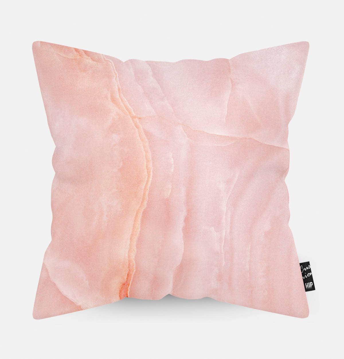 Kussen met roze marmeren steen erop afgebeeld.