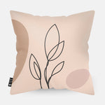 Kussen met line art van botanische plant erop.