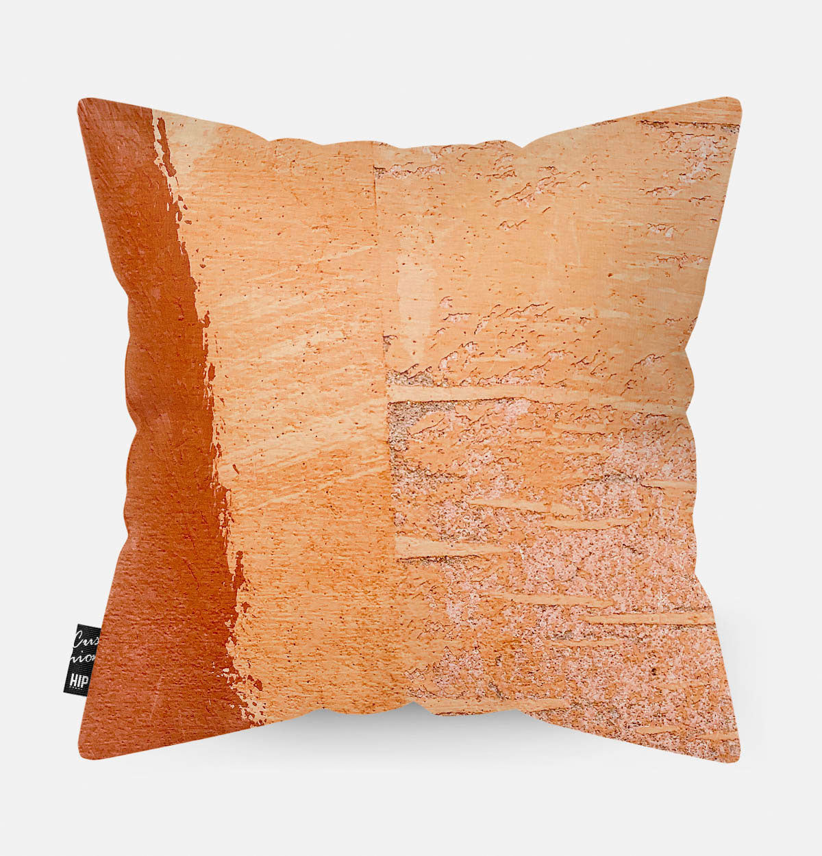 Kussen met terracotta steen erop afgebeeld.