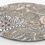 Zijkant van een muurcirkel met bloemenpatroon in beige kleur