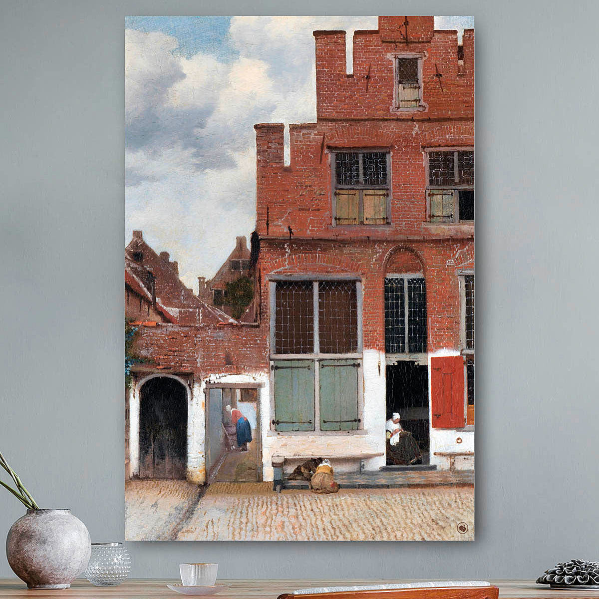 Vierkante wanddecoratie met het straatje erop.