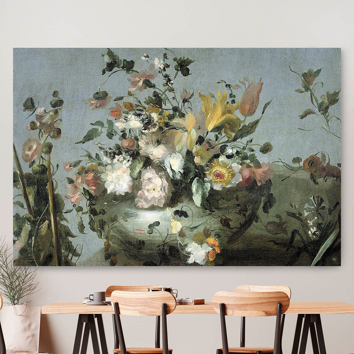 Vierkante wanddecoratie met bloemen van Guadi erop.