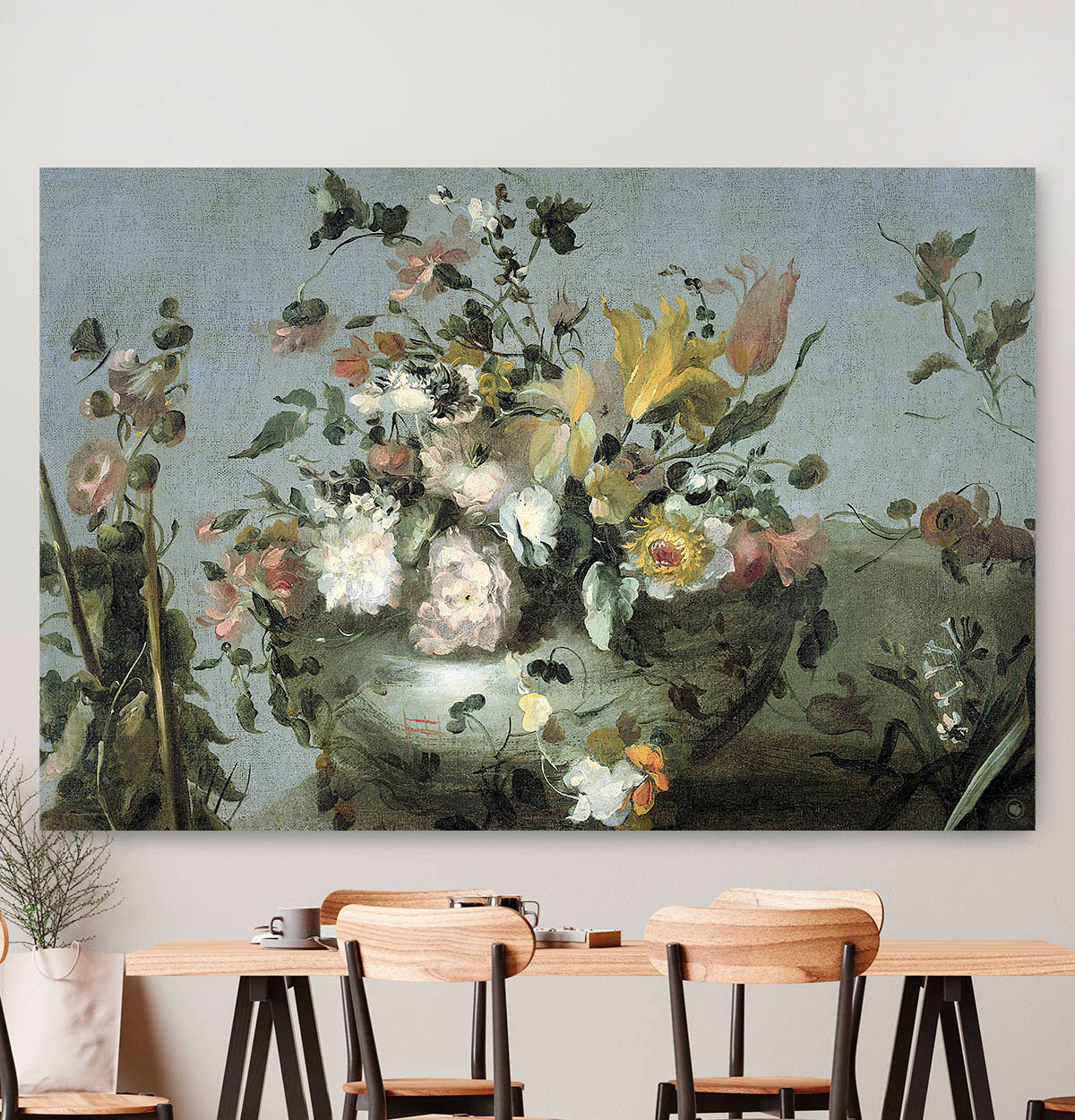 Vierkante wanddecoratie met bloemen van Guadi erop.