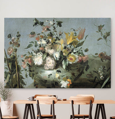 Vierkante wanddecoratie met bloemen van Guadi erop.