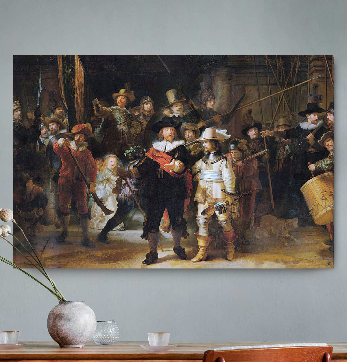 Vierkante wanddecoratie met schilderij van de Nachtwacht erop.