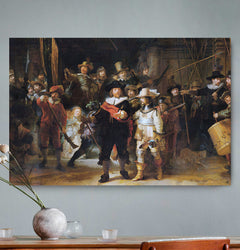 Vierkante wanddecoratie met schilderij van de Nachtwacht erop.
