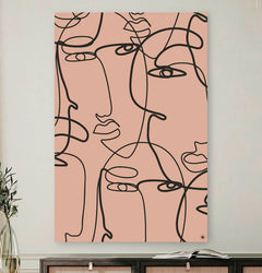 Vierkante wanddecoratie met meerdere gezichten in moderne kunst erop.