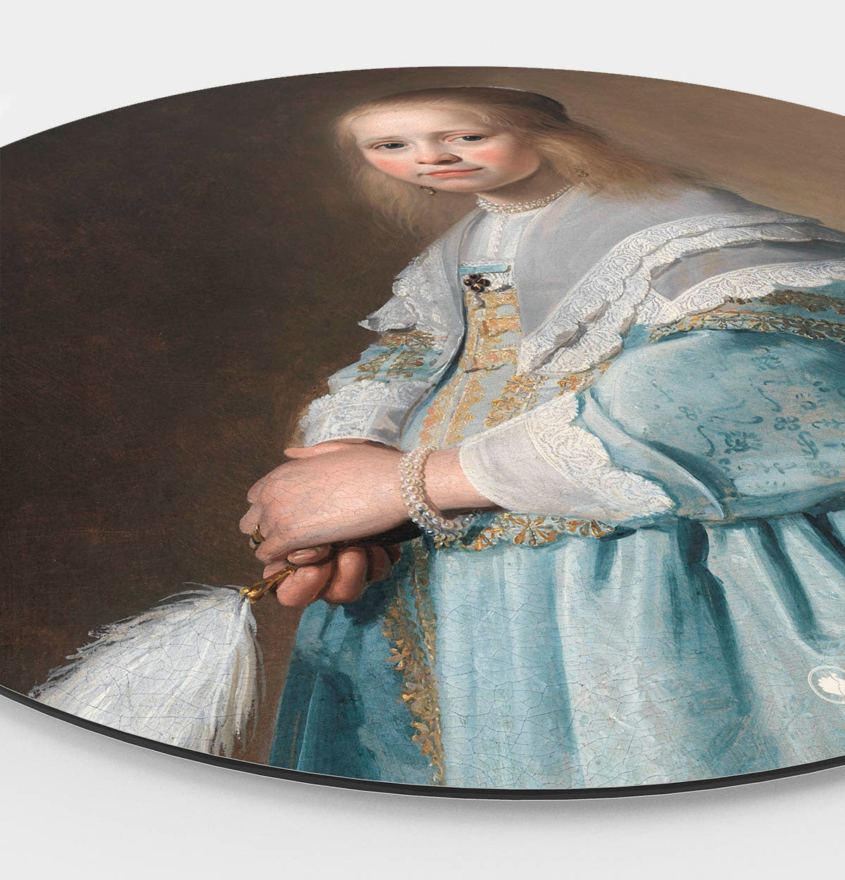 Wandcirkel van portret van een meisje in het blauw.