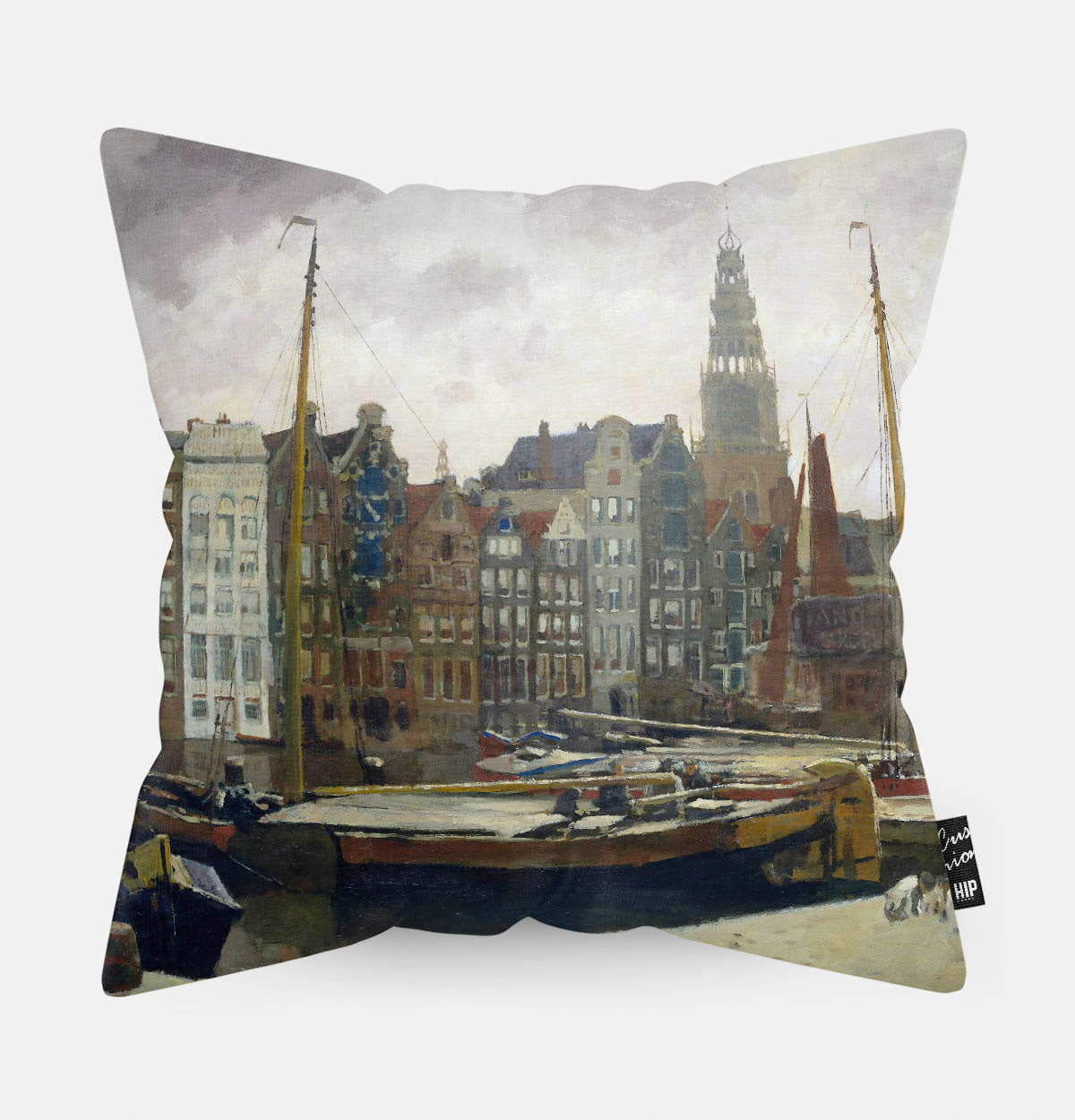 Kussen met schildering van damrak in Amsterdam erop afgebeeld.