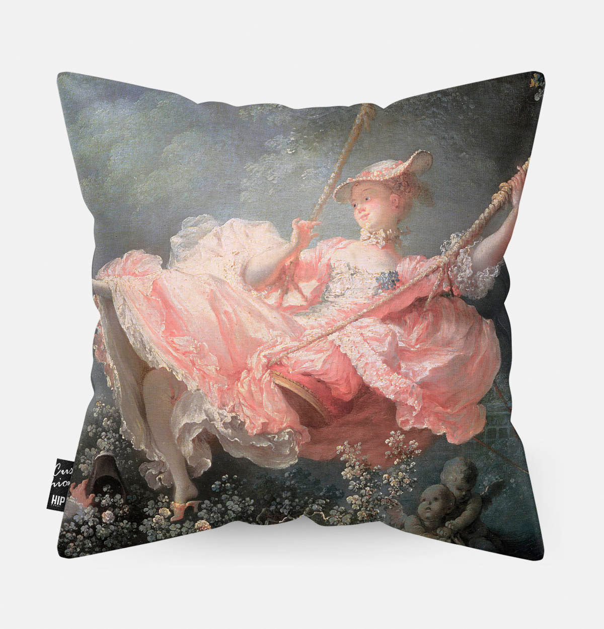 Kussen met schilderij van de schommel met een meisje in het roze erop afgebeeld.