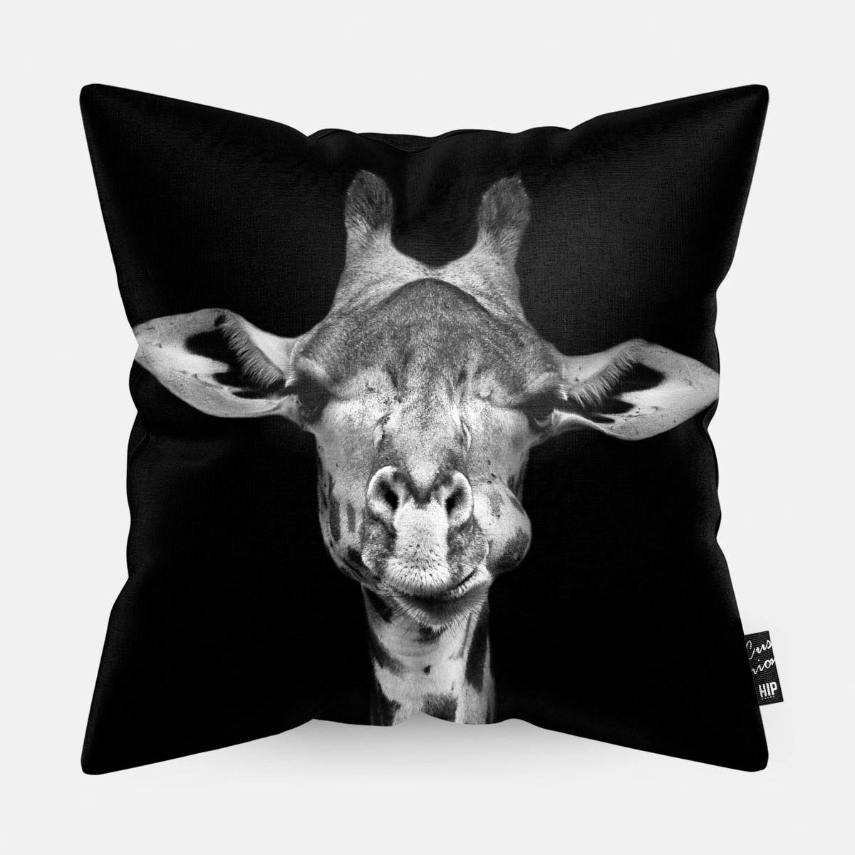 Kussen met een giraf in zwart-wit erop afgebeeld.
