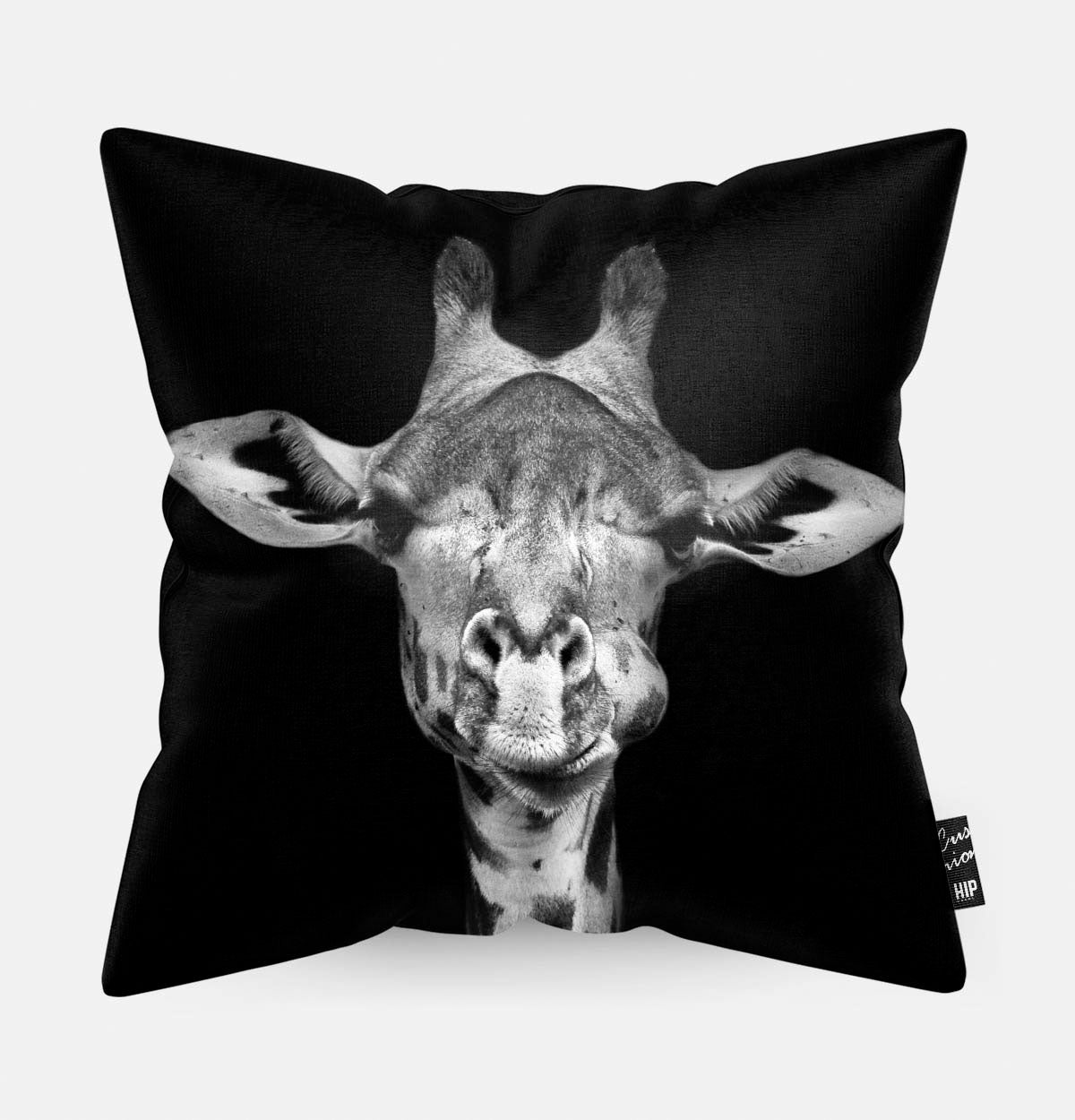 Kussen met een giraf in zwart-wit erop afgebeeld.