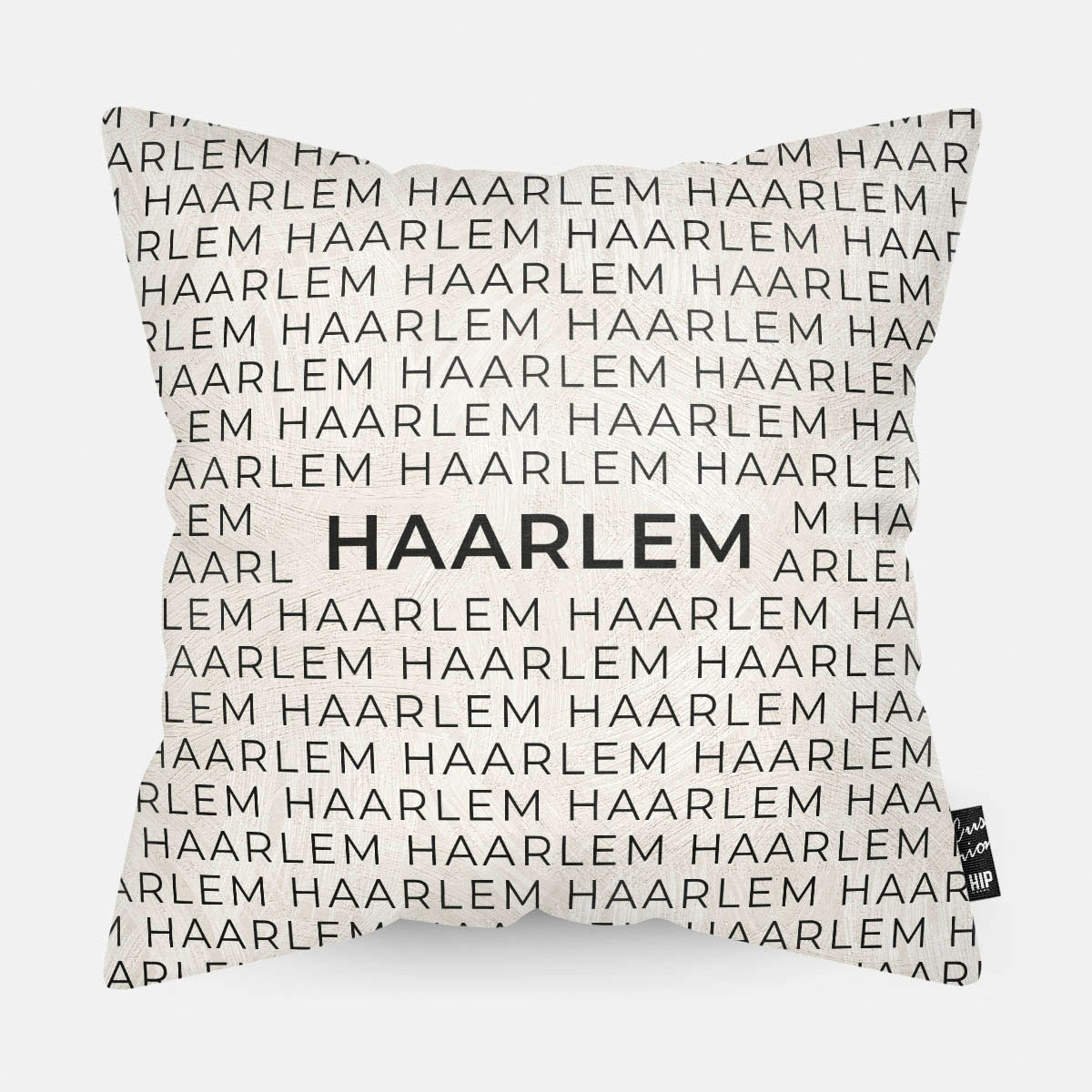 Sierkussen met stad en map Haarlem in tekst en zwart wit