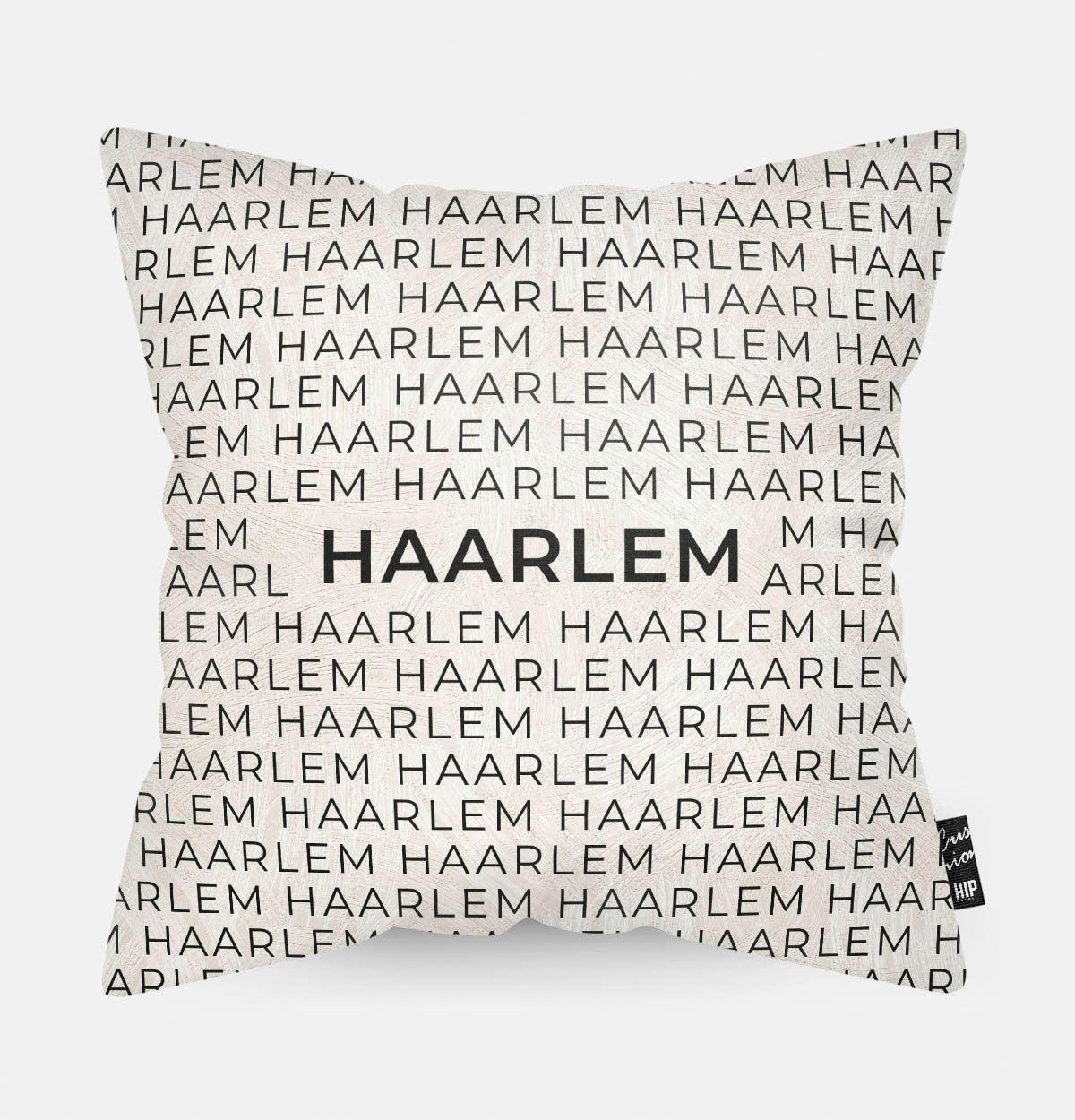 Sierkussen met stad en map Haarlem in tekst en zwart wit