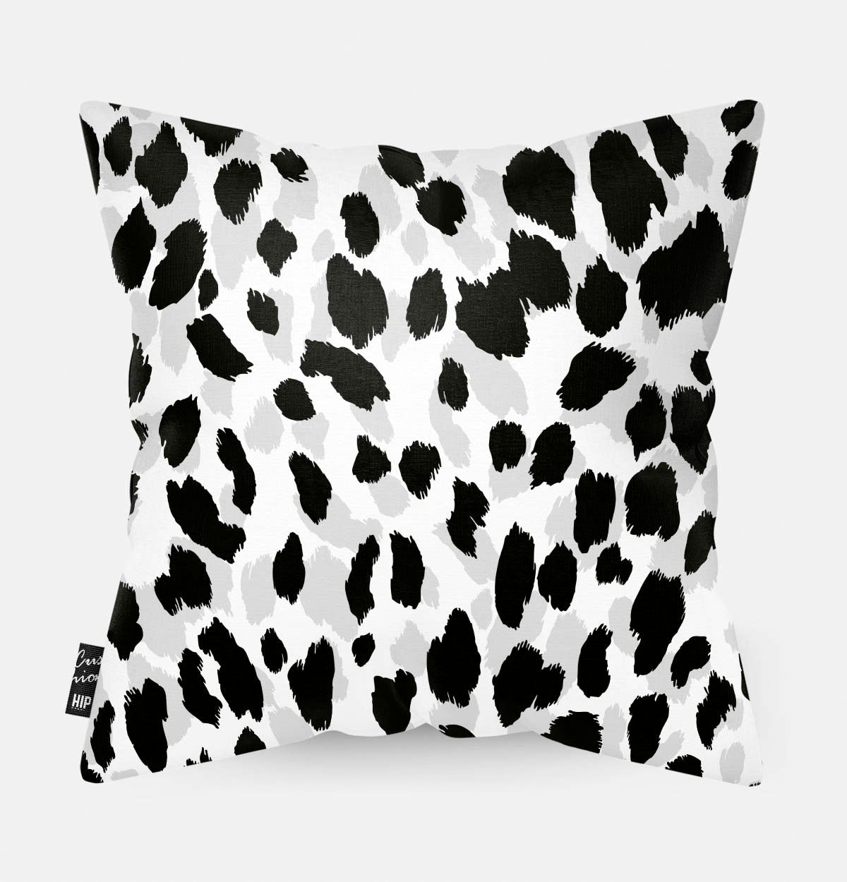 Kussen met de patronen van een luipaard in zwart-wit erop afgebeeld.