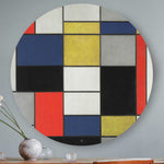 Mondriaan wandcirkel rood, geel, grijs, blauw, wit hangend aan de muur