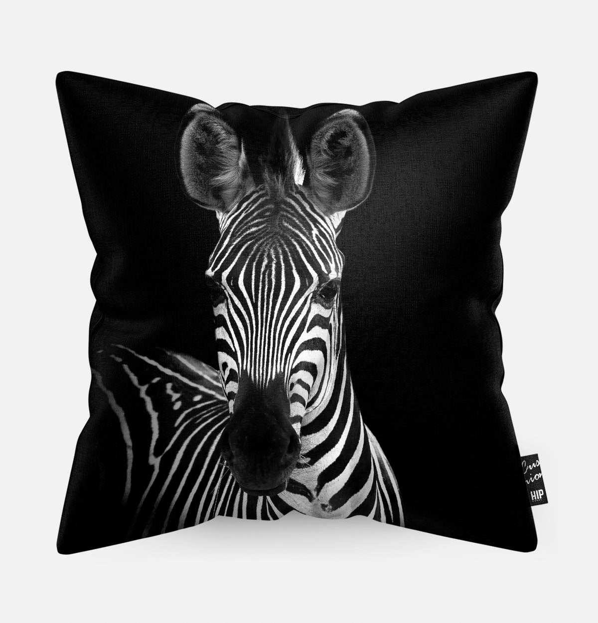 Kussen met een zebra in zwart-wit erop afgebeeld.