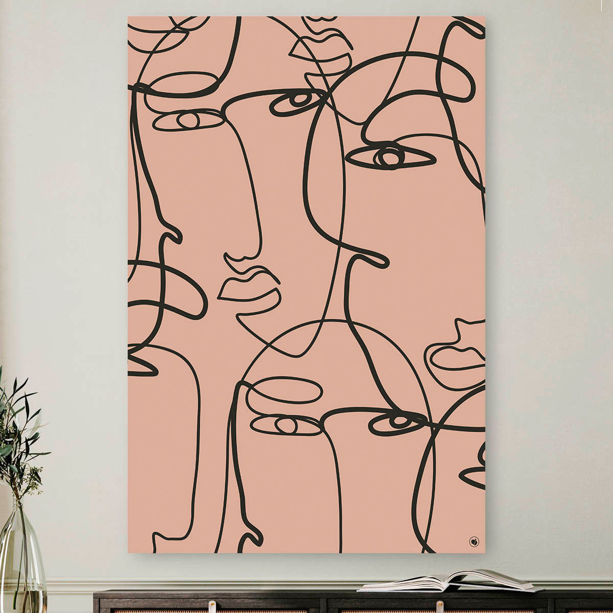 Vierkante wanddecoratie met meerdere gezichten in moderne kunst erop.